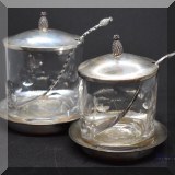 S10. Pair of sterling silver and glass jam jars with spoons and underplates - $125 